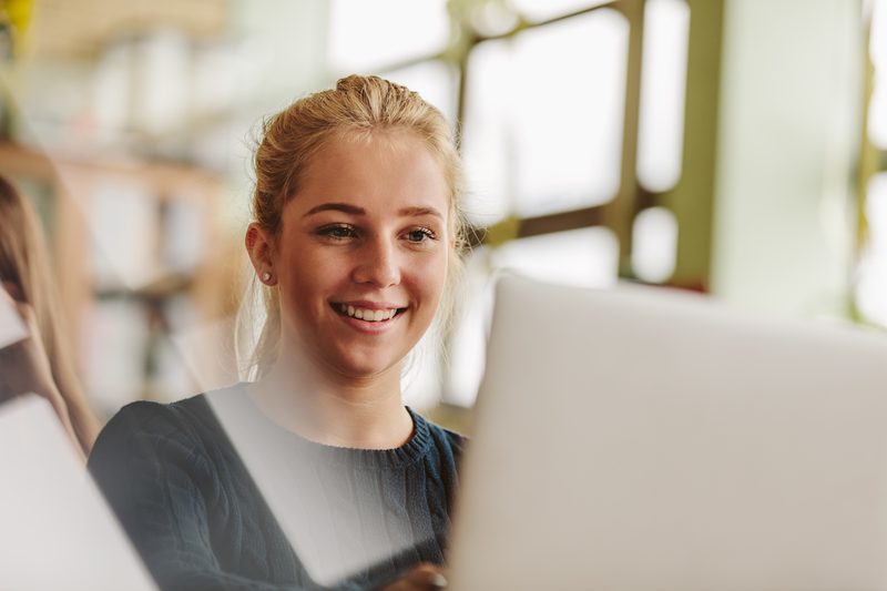 Student enrolling online on a laptop