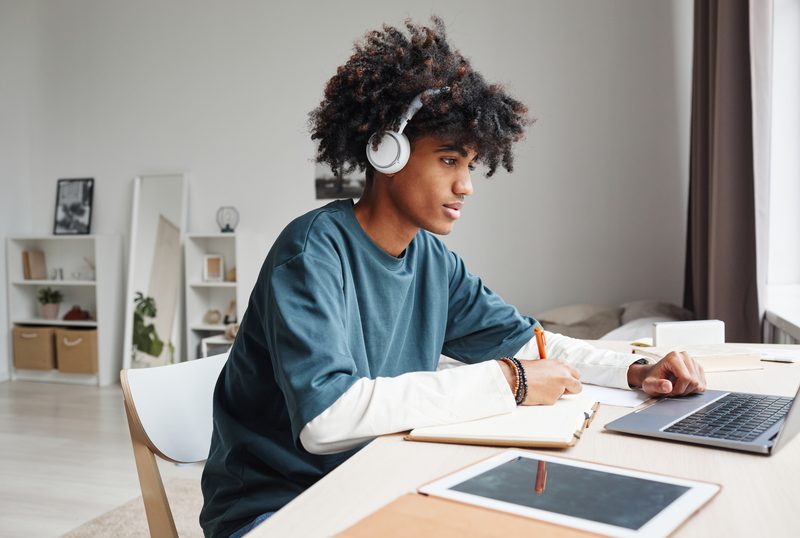 Student studying with headphones